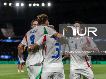 Federico Dimarco of Italy celebrates a goal with his teammates during the UEFA Nations League 2024/25 League A Group A2 match between France...