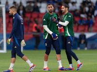 Guglielmo Vicario and Alex Meret of Italy warm up before the UEFA Nations League 2024/25 League A Group A2 match between France and Italy at...