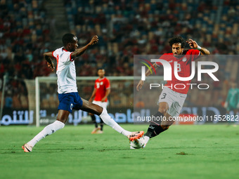 Egypt's Mohamed Hany challenges Cape Verde's player during the Egypt vs Cape Verde match in the 2025 Africa Cup of Nations Qualifiers Morocc...