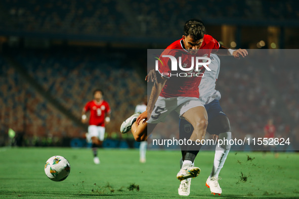 Egypt's Ahmed El Sayed Zizo challenges Cape Verde's player during the Egypt vs Cape Verde match in the 2025 Africa Cup of Nations Qualifiers...