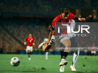 Egypt's Ahmed El Sayed Zizo challenges Cape Verde's player during the Egypt vs Cape Verde match in the 2025 Africa Cup of Nations Qualifiers...