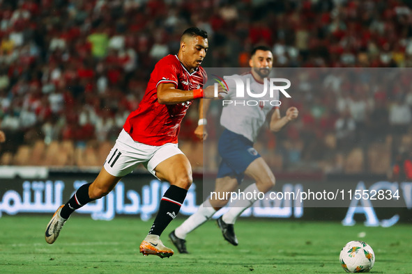 Egypt's Mostafa Mohamed challenges Cape Verde's player during the Egypt vs Cape Verde match in the 2025 Africa Cup of Nations Qualifiers Mor...