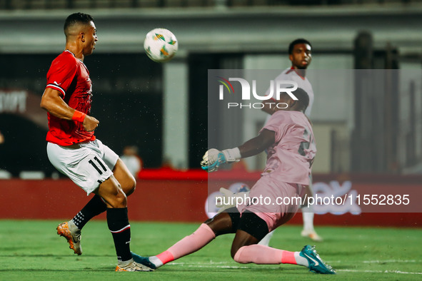 Egypt's Mostafa Mohamed challenges Cape Verde's player during the Egypt vs Cape Verde match in the 2025 Africa Cup of Nations Qualifiers Mor...