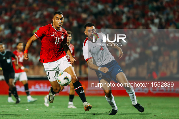 Egypt's Mostafa Mohamed challenges Cape Verde's player during the Egypt vs Cape Verde match in the 2025 Africa Cup of Nations Qualifiers Mor...