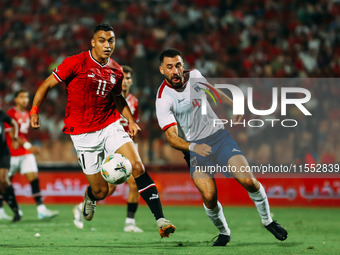 Egypt's Mostafa Mohamed challenges Cape Verde's player during the Egypt vs Cape Verde match in the 2025 Africa Cup of Nations Qualifiers Mor...