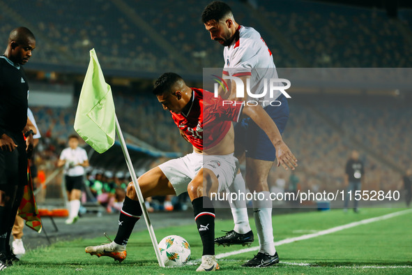 Egypt's Mostafa Mohamed challenges Cape Verde's player during the Egypt vs Cape Verde match in the 2025 Africa Cup of Nations Qualifiers Mor...