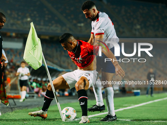 Egypt's Mostafa Mohamed challenges Cape Verde's player during the Egypt vs Cape Verde match in the 2025 Africa Cup of Nations Qualifiers Mor...