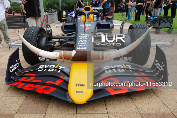 A Texas-themed F1 car outfitted with longhorn horns and ''slab'' wheels wows attendees at a private preview event for Red Bull's Houston Sho...