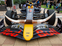 A Texas-themed F1 car outfitted with longhorn horns and ''slab'' wheels wows attendees at a private preview event for Red Bull's Houston Sho...