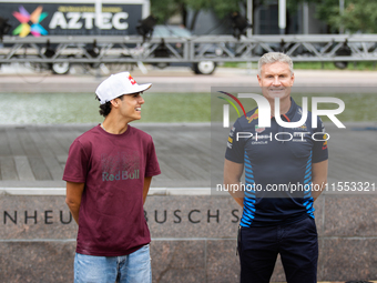 Red Bull Junior Driver Arvid Lindblad laughs between press photos as former Formula 1 driver David Coulthard looks forward at a private prev...