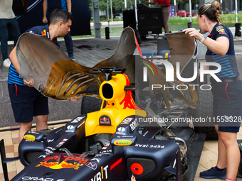 Red Bull engineers prepare the RB8 for engine revving at a private preview event for Red Bull's Houston Showrun in Houston, Texas, on Septem...