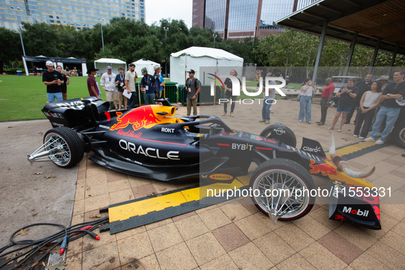 A Texas-themed F1 car outfitted with longhorn horns and ''slab'' wheels wows attendees at a private preview event for Red Bull's Houston Sho...