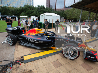 A Texas-themed F1 car outfitted with longhorn horns and ''slab'' wheels wows attendees at a private preview event for Red Bull's Houston Sho...