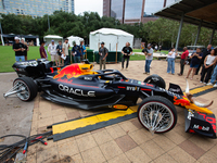 A Texas-themed F1 car outfitted with longhorn horns and ''slab'' wheels wows attendees at a private preview event for Red Bull's Houston Sho...