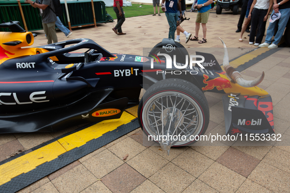 A Texas-themed F1 car outfitted with longhorn horns and ''slab'' wheels wows attendees at a private preview event for Red Bull's Houston Sho...