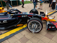 A Texas-themed F1 car outfitted with longhorn horns and ''slab'' wheels wows attendees at a private preview event for Red Bull's Houston Sho...