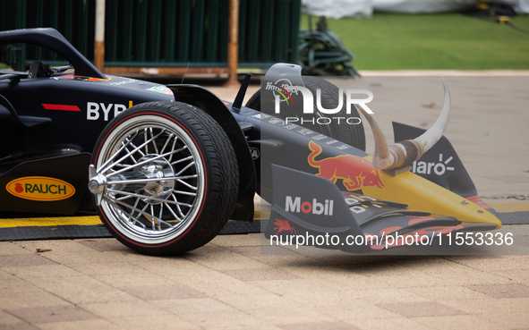 A Texas-themed F1 car outfitted with longhorn horns and ''slab'' wheels wows attendees at a private preview event for Red Bull's Houston Sho...