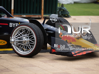 A Texas-themed F1 car outfitted with longhorn horns and ''slab'' wheels wows attendees at a private preview event for Red Bull's Houston Sho...