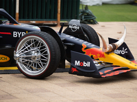 A Texas-themed F1 car outfitted with longhorn horns and ''slab'' wheels wows attendees at a private preview event for Red Bull's Houston Sho...