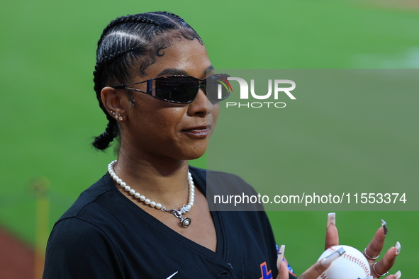 USA Olympic gymnast Jordan Chiles poses on the field to throw out the ceremonial first pitch before the baseball game between the Cincinnati...