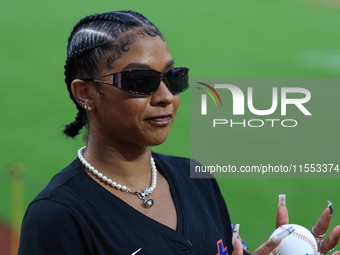 USA Olympic gymnast Jordan Chiles poses on the field to throw out the ceremonial first pitch before the baseball game between the Cincinnati...