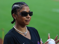 USA Olympic gymnast Jordan Chiles poses on the field to throw out the ceremonial first pitch before the baseball game between the Cincinnati...