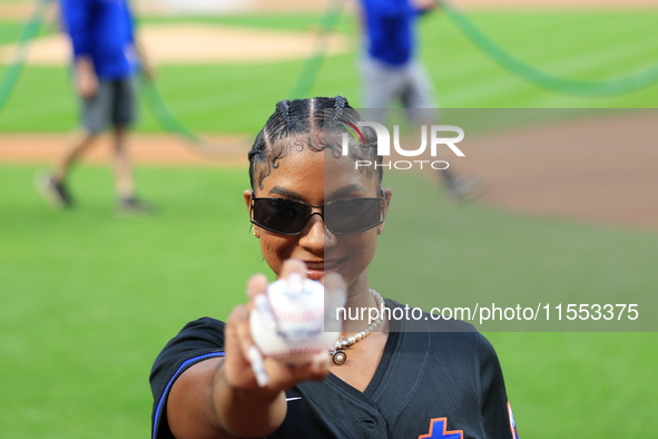 USA Olympic gymnast Jordan Chiles poses on the field to throw out the ceremonial first pitch before the baseball game between the Cincinnati...