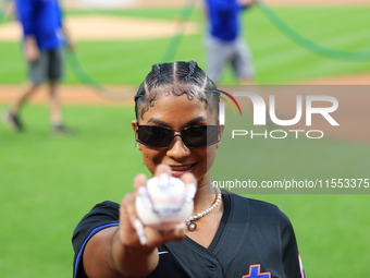 USA Olympic gymnast Jordan Chiles poses on the field to throw out the ceremonial first pitch before the baseball game between the Cincinnati...