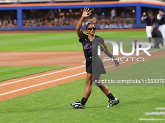 USA Olympic gymnast Jordan Chiles walks out on the field to throw out the ceremonial first pitch before the baseball game between the Cincin...