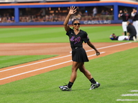 USA Olympic gymnast Jordan Chiles walks out on the field to throw out the ceremonial first pitch before the baseball game between the Cincin...