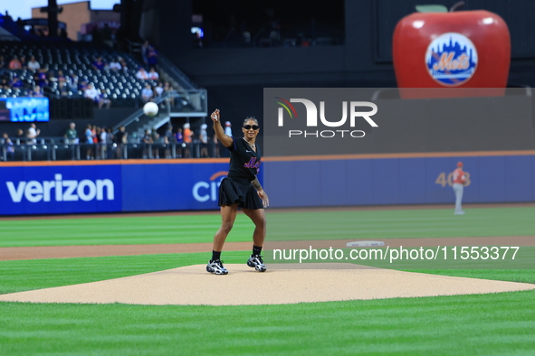 USA Olympic gymnast Jordan Chiles throws out the ceremonial first pitch before the baseball game between the Cincinnati Reds and New York Me...