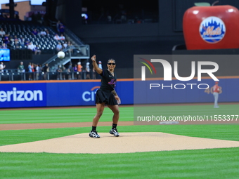 USA Olympic gymnast Jordan Chiles throws out the ceremonial first pitch before the baseball game between the Cincinnati Reds and New York Me...