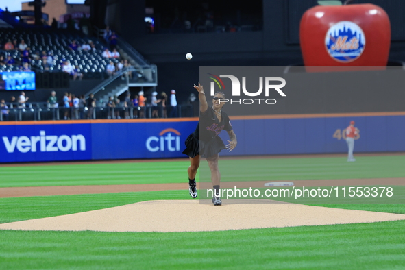 USA Olympic gymnast Jordan Chiles throws out the ceremonial first pitch before the baseball game between the Cincinnati Reds and New York Me...