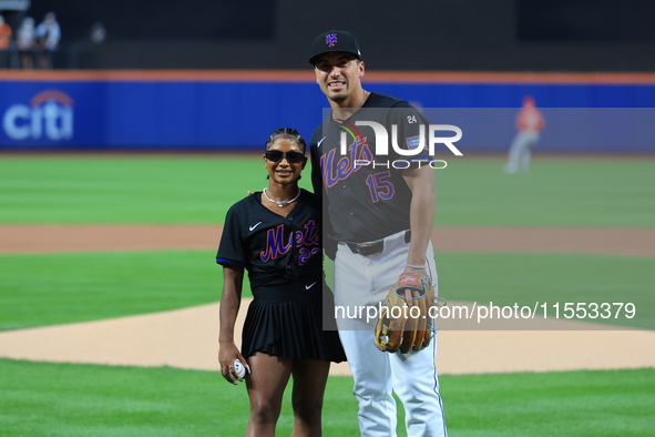 USA Olympic gymnast Jordan Chiles poses for a photo with the Mets' Tyrone Taylor after throwing out the ceremonial first pitch before the ba...