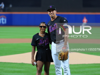 USA Olympic gymnast Jordan Chiles poses for a photo with the Mets' Tyrone Taylor after throwing out the ceremonial first pitch before the ba...