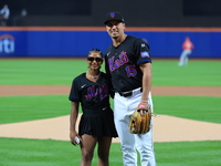 USA Olympic gymnast Jordan Chiles poses for a photo with the Mets' Tyrone Taylor after throwing out the ceremonial first pitch before the ba...