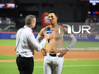 Mark Vientos #27 of the New York Mets is interviewed by SNY's Steve Gelbs after hitting a game-winning home run in the 10th inning to lift t...