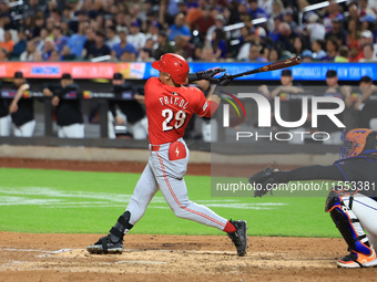 Cincinnati Reds' TJ Friedl #29 hits a two-run homer during the seventh inning of the baseball game against the New York Mets at Citi Field i...