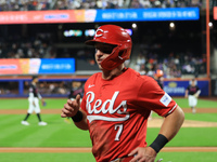 TJ Friedl #29 of the Cincinnati Reds is congratulated after hitting a two-run homer during the seventh inning of the baseball game against t...