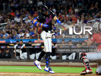 Jeff McNeil #1 of the New York Mets is hit by a pitch during the fifth inning of the baseball game against the Cincinnati Reds at Citi Field...