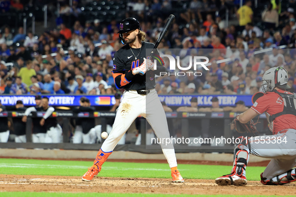 Jesse Winker #3 of the New York Mets is hit by a pitch during the fourth inning of the baseball game against the Cincinnati Reds at Citi Fie...