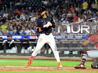 Jesse Winker #3 of the New York Mets is hit by a pitch during the fourth inning of the baseball game against the Cincinnati Reds at Citi Fie...