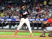 Jesse Winker #3 of the New York Mets is hit by a pitch during the fourth inning of the baseball game against the Cincinnati Reds at Citi Fie...