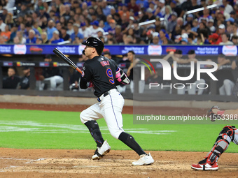 Brandon Nimmo #9 of the New York Mets singles during the seventh inning of the baseball game against the Cincinnati Reds at Citi Field in Co...