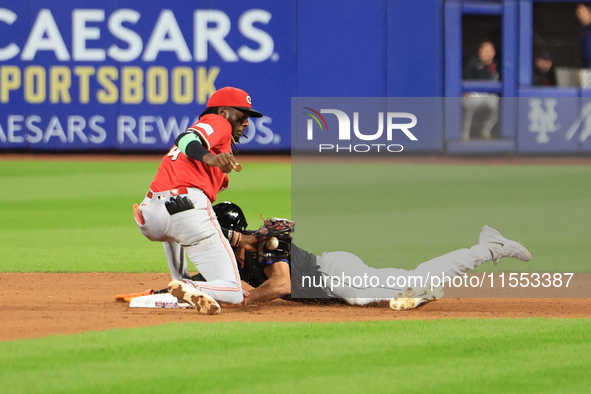 New York Mets Tyrone Taylor #15 steals second base during the ninth inning of the baseball game against the Cincinnati Reds at Citi Field in...