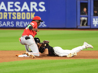 New York Mets Tyrone Taylor #15 steals second base during the ninth inning of the baseball game against the Cincinnati Reds at Citi Field in...