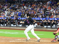 New York Mets J.D. Martinez #28 singles during the sixth inning of the baseball game against the Cincinnati Reds at Citi Field in Corona, Ne...