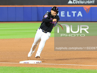 New York Mets' Jose Iglesias #11 scores from 2B during the sixth inning of the baseball game against the Cincinnati Reds at Citi Field in Co...