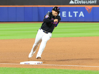 New York Mets' Jose Iglesias #11 scores from 2B during the sixth inning of the baseball game against the Cincinnati Reds at Citi Field in Co...