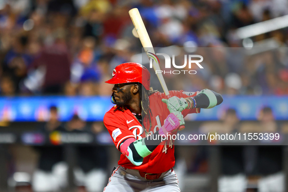 Elly De La Cruz #44 of the Cincinnati Reds hits the ground after avoiding a pitch during the ninth inning of the baseball game against the N...